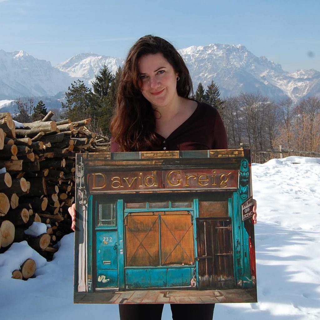 Michelle Heron with one of her paintings